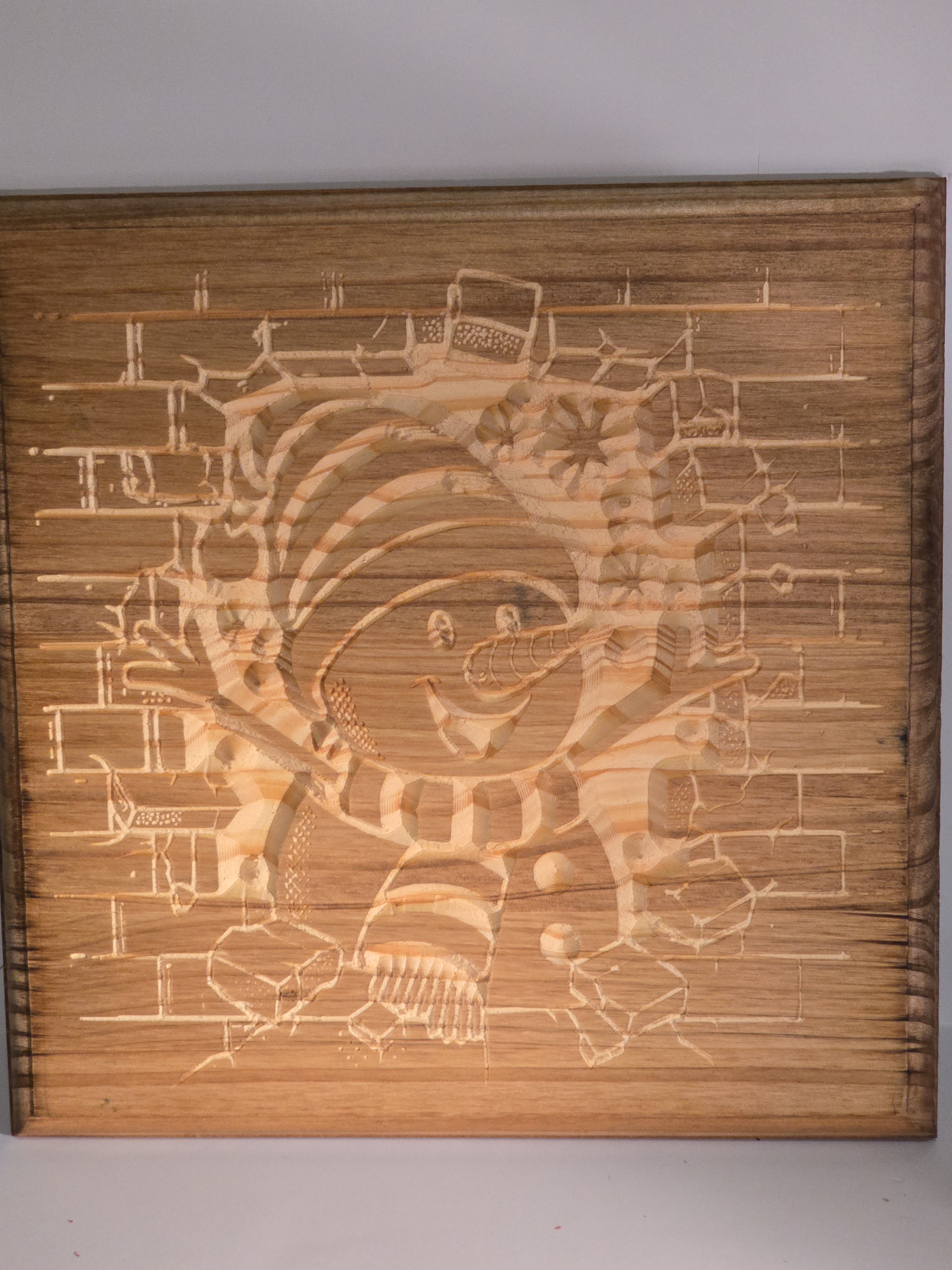 plaque wall art with engraved design on of a snowman