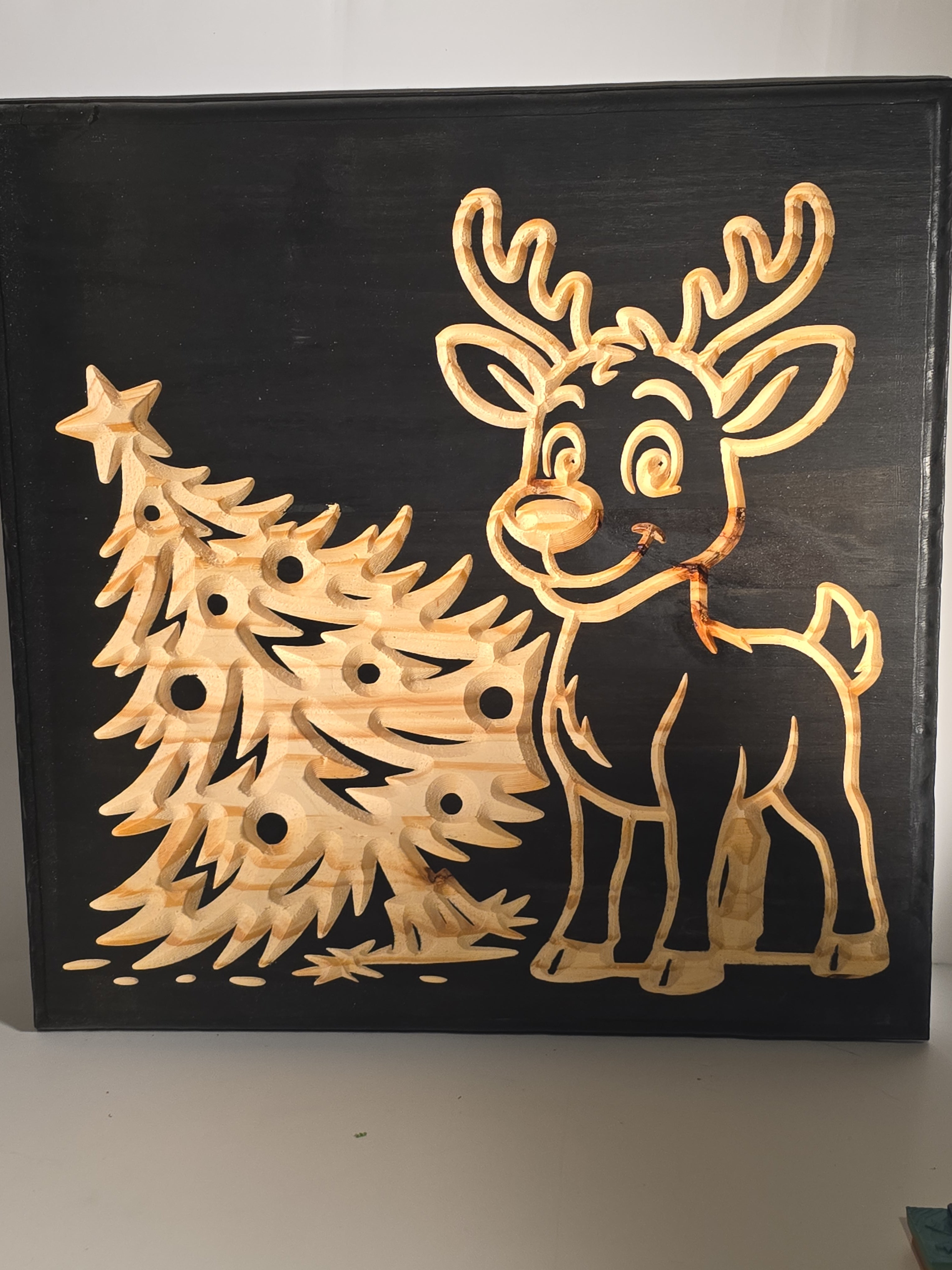 plaque with reindeer and tree